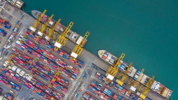 Aerial view of container ship docked at an international shipping terminal