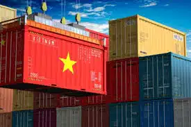 Vietnam-flagged shipping container being loaded at port for international transport.