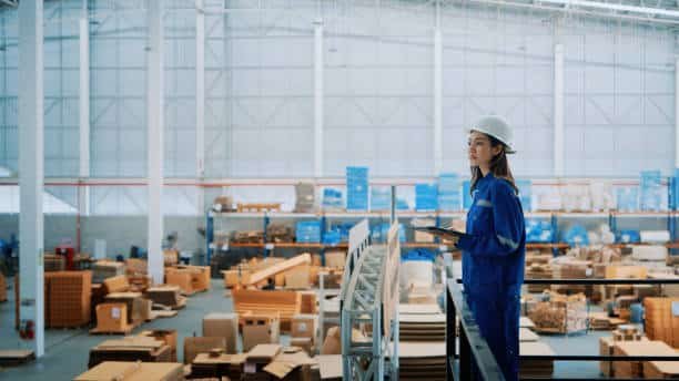 Worker inspecting goods in a Chinese warehouse before exporting to Tunisia