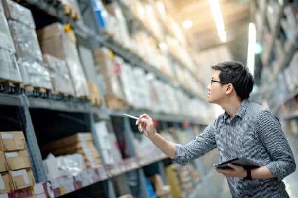 Logistics staff managing inventory in a warehouse before export to Costa Rica