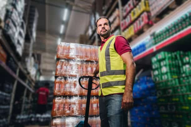Warehouse worker managing product inventory before shipment to Argentina