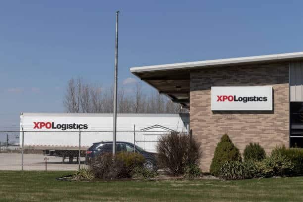 XPO Logistics building and transport truck, representing third-party drayage providers in the logistics industry.