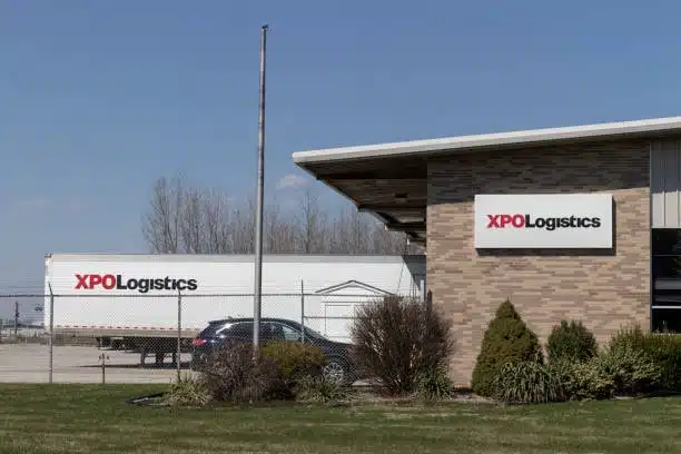 XPO Logistics building and transport truck, representing third-party drayage providers in the logistics industry.