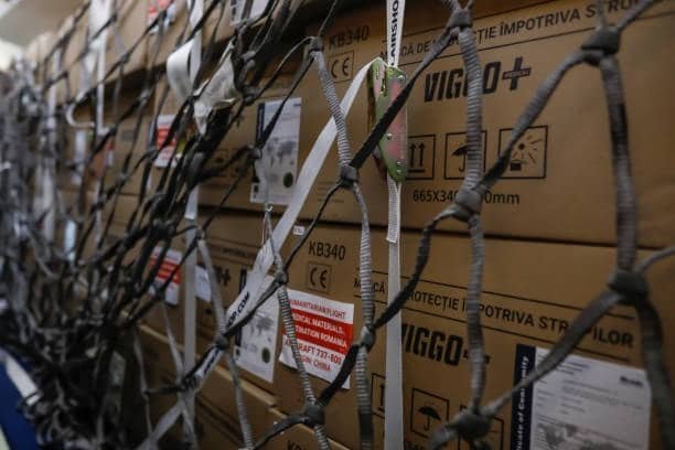 ABS-protected cargo boxes secured in a net for air freight shipping