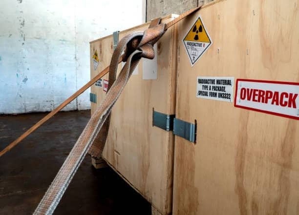 Crate labeled with radioactive warning and overpack notice