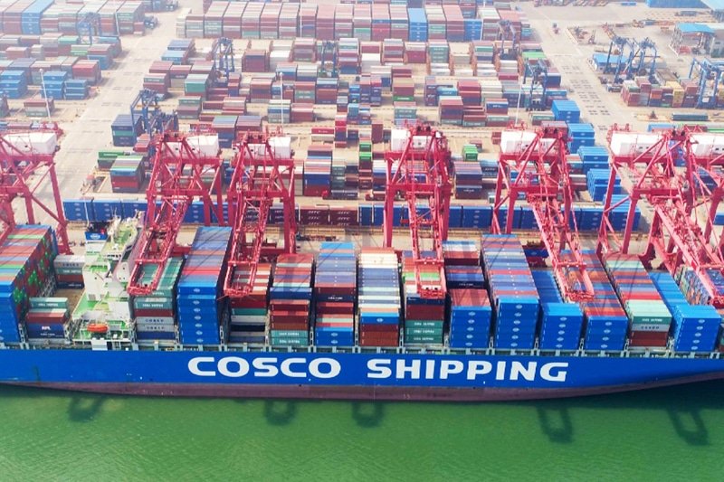 COSCO container ship loading goods in China for export to Malaysia