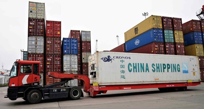 Truck transporting a China Shipping container at the port