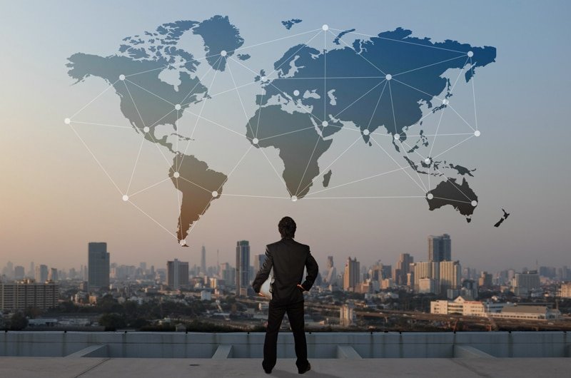 Businessman analyzing global trade network with focus on Southeast Asia logistics strategy