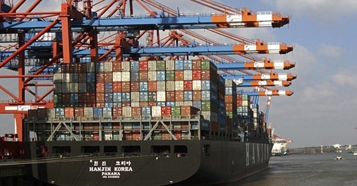 Hanjin Korea container ship at dockside with cranes loading and unloading cargo