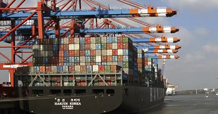 Hanjin Korea container ship at dockside with cranes loading and unloading cargo