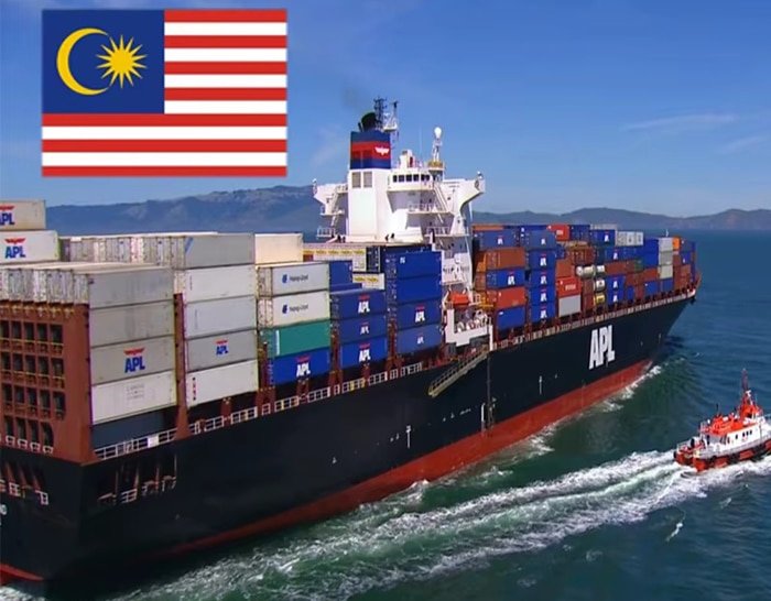 APL container ship en route to Malaysia with national flag in background