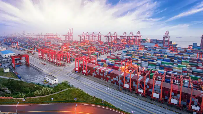 Busy container port in Shanghai preparing sea freight for Malaysia