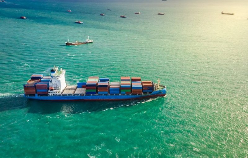 Container ship sailing in Asian waters promoting sustainable maritime shipping