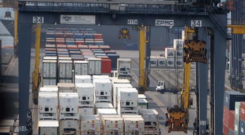 Container terminal at Jakarta port with cranes handling inbound cargo from China